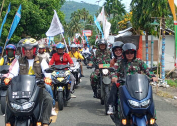 Bendera Petaka KPK Gorut Diarak Dari Ujung Pantai Utara Kecamatan Tolinggula